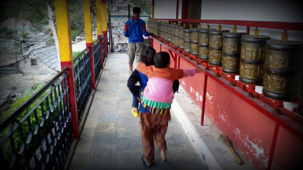 Wonder what she is praying for. At the Tibetan temple in Kalpa